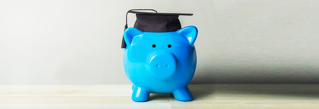 blue piggie bank wearing graduation cap