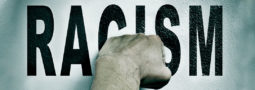 Image of a Fist and the words Racism