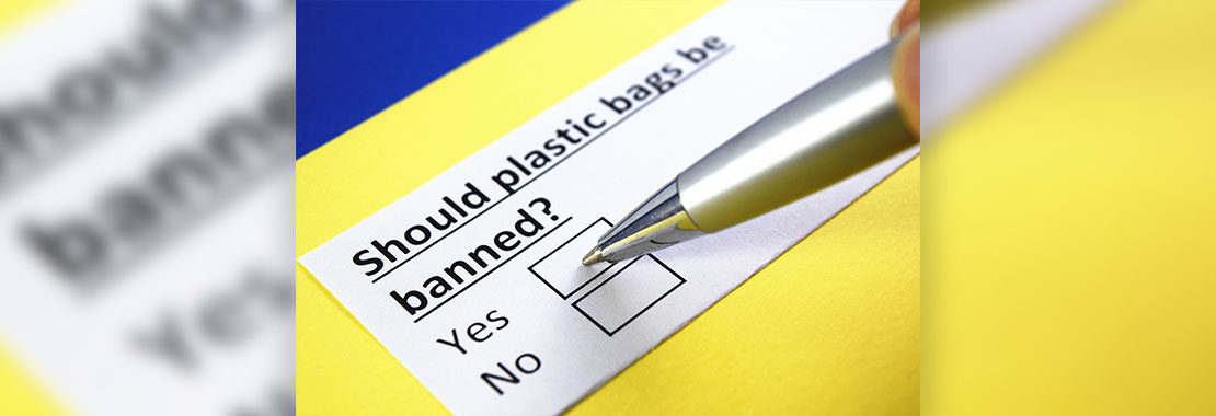 Image of someone voting for a plastics ban