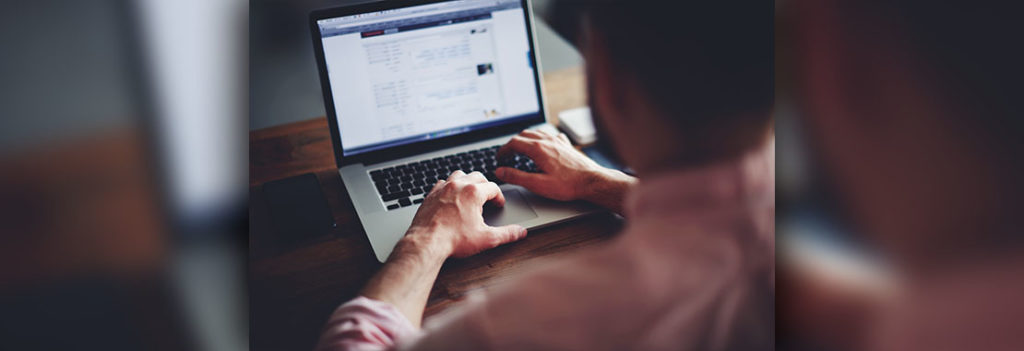 person typing at computer