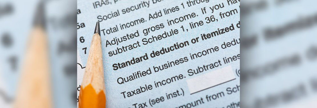 image of a pencil and the words "standard deductions"