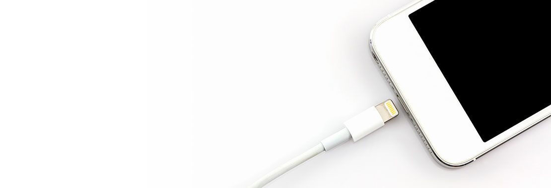 image of a cell phone being plugged in