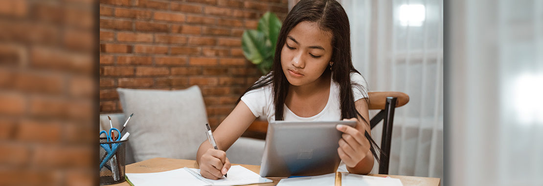 girl taking a test online