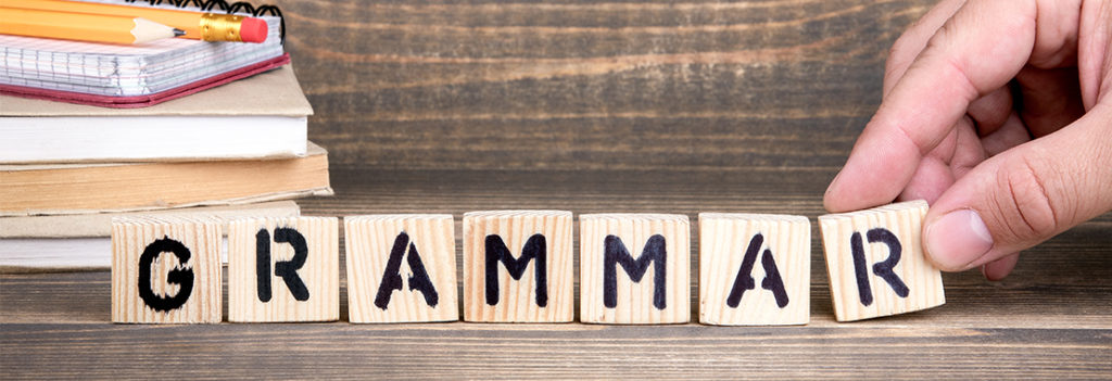 Image of blocks spelling out grammar