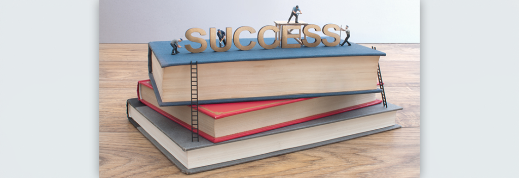 Image of "Success" written atop three books.