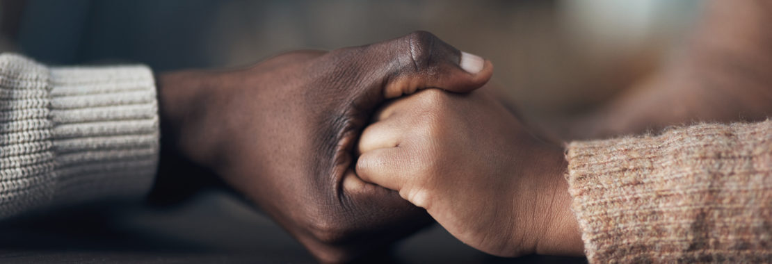 image of two hands embracing