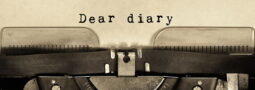 Typewriter with "dear diary" typed out on paper