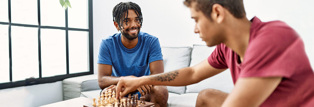 Two young men playing chess