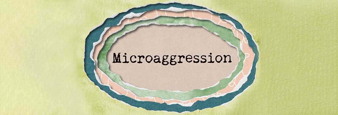 A circle of torn paper. In the center is the word "Microaggression"
