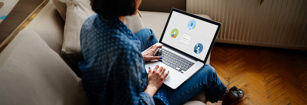 Photograph of a woman using a laptop.