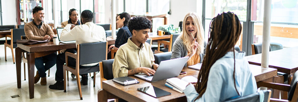 Several students study in a college setting.